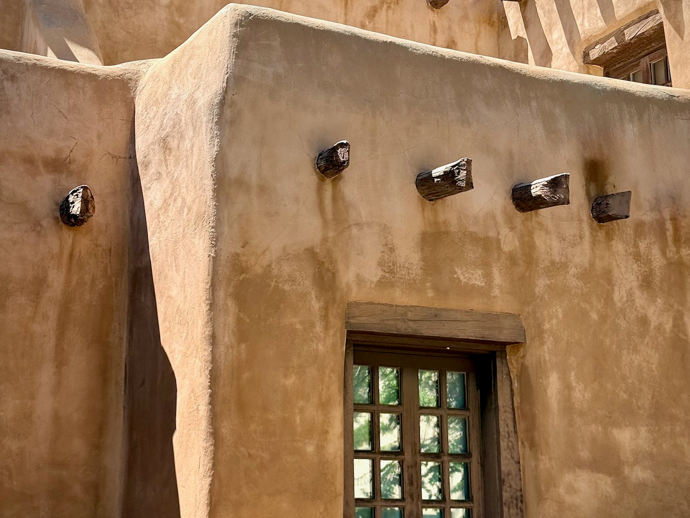 Adobe architecture with projecting viga beams in Santa Fe, New Mexico